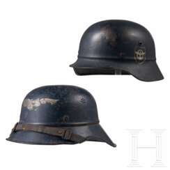 A Fire Protection Police double decal helmet M38 and a Reichsluftschutzbund helmet