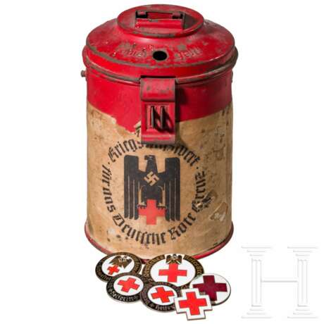 A collection of German Red Cross badges and a donation can - photo 1