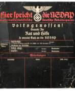 Overview. A wall plaque "Hier spricht die NSDAP"