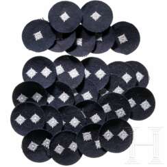 An officer's cap badge of Gruppo Corazzato S. Giusto, two party badges and a leaflet of Decima MAS