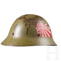 A steel helmet M 30/32, ‘Type 90’ of the Imperial Japanese Army, battle damaged