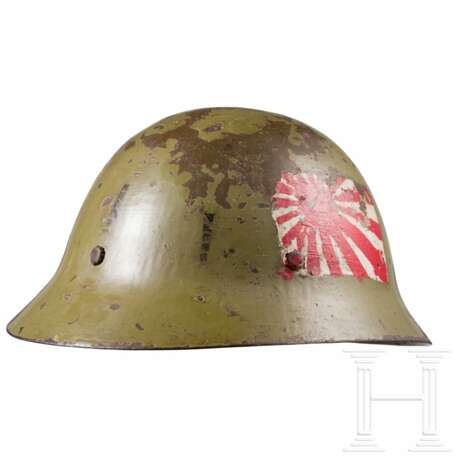 A steel helmet M 30/32, ‘Type 90’ of the Imperial Japanese Army, battle damaged - photo 1 A steel helmet M 30/32, ‘Type 90’ of the Imperial Japanese Army, battle damaged - photo 1