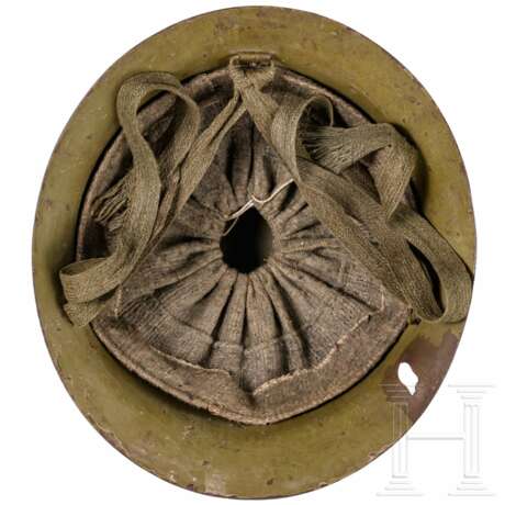 A steel helmet M 30/32, ‘Type 90’ of the Imperial Japanese Army, battle damaged - photo 3 A steel helmet M 30/32, ‘Type 90’ of the Imperial Japanese Army, battle damaged - photo 3