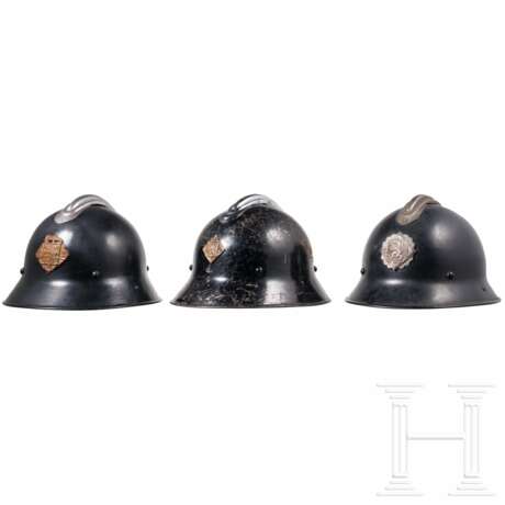 Three firefighters' helmets - photo 1