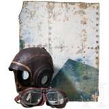 A US Air Force flying helmet, a pair of Royal Air Force pilot goggles and a part of an aircraft fuselage - photo 1