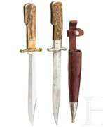 Couverts. Zwei Klappmesser mit Hirschhorngriffen, deutsch, um 1900