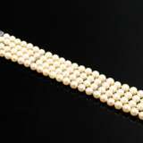 Four-row cultured pearl bracelet with simple white… - photo 1