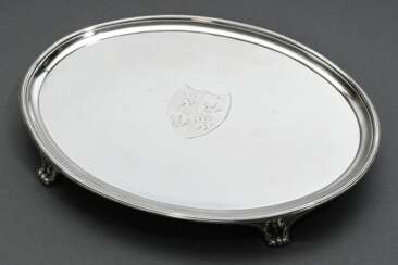 Oval salver in simple design with engraved coat of…