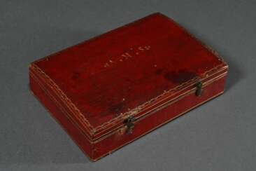 Antique jewellery box with gold-embossed red saffi…