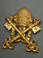 Papal emblem consisting of crossed keys and tiara,…