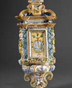 Folk art. Majolica wall-mounted holy water font in baroque a…