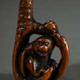 Wooden netsuke ‘Monkey in eagle's claw’ with inlai… - photo 1