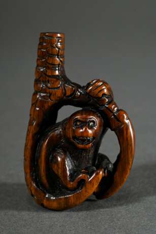 Wooden netsuke ‘Monkey in eagle's claw’ with inlai… - photo 1