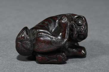 Large hardwood netsuke ‘Reclining Shishi’, 18th ce…