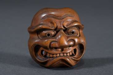 Boxwood netsuke ‘Nō mask frown Shikami’ with curve…