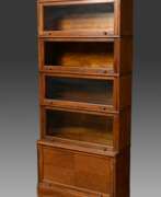 Обзор. Patent bookcase with 5 compartments, labelled: ‘Id…