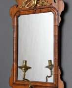 Зеркала. Small console mirror with gilded carving decoratio…