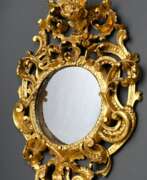 Зеркала. Round baroque mirror with rocaille leaves and flow…