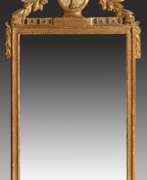 Зеркала. Large classicist console mirror with finely carved…