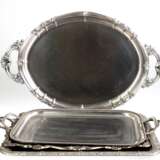 4 diverse Tabletts, Weißmetall, teils versilbert, 3x mit 3 seitl. Henkeln, L. 53 cm, 56 cm, 63 cm und 49x38 cm - photo 1