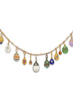Neck jewellery. A NECKLACE OF THIRTEEN JEWELLED, GOLD, SILVER AND GUILLOCH&#201; ENAMEL EGG PENDANTS