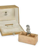 Silver. A SILVER-MOUNTED CLAY BRICK MATCH HOLDER