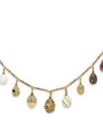 Neck jewellery. A NECKLACE OF FIFTEEN JEWELLED, GOLD, SILVER, HARDSTONE, GUILLOCH&#201; AND CLOISONN&#201; ENAMEL EGG PENDANTS