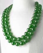 Halsketten. TWO JADEITE BEAD AND DIAMOND NECKLACES