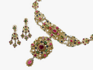 A necklace and a pair of drop earrings with pearls, sapphires, peridots, pink sapphires, and garnets