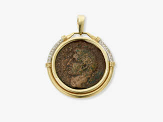 A coin pendant with small brilliant-cut diamonds