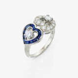 A ring with two hearts, sapphires, and brilliant-cut diamonds - фото 1