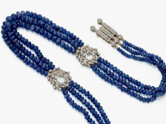 A three-strand Collier-de-chien made of sapphire rondelles with brilliant-cut diamonds - photo 1 A three-strand Collier-de-chien made of sapphire rondelles with brilliant-cut diamonds - photo 1