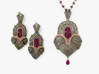 A demi-parure consisting of a necklace with pendant and a pair of earrings with rubies and diamonds