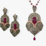 A demi-parure consisting of a necklace with pendant and a pair of earrings with rubies and diamonds - photo 1