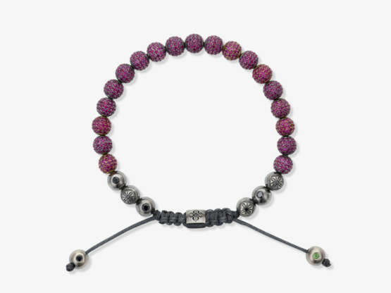 A braided bracelet with ruby-studded beads - фото 1