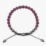 A braided bracelet with ruby-studded beads - фото 1