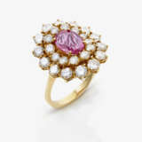 A ring with pink sapphire and brilliant-cut diamonds - фото 1