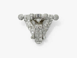 A historical dress clip adorned with octagonal-cut diamonds