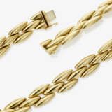 A gold necklace - photo 1