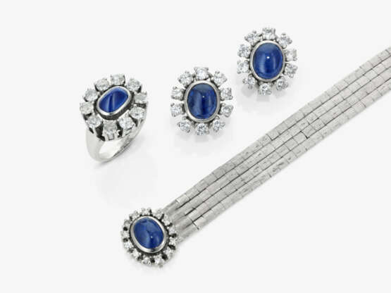 Earrings, ring, and a white gold bracelet with diamonds and sapphires - photo 1