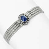 Earrings, ring, and a white gold bracelet with diamonds and sapphires - photo 2