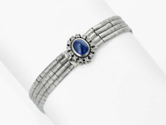 Earrings, ring, and a white gold bracelet with diamonds and sapphires - photo 2