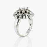 A demi-parure, white gold earrings and a platinum ring with diamonds - фото 4