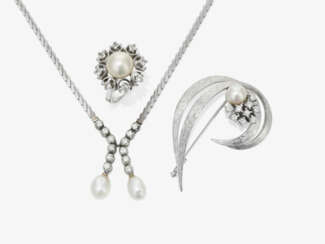 A necklace and brooch with diamonds and cultured pearls