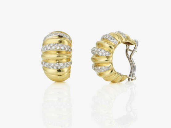 A pair of hoop earrings adorned with octagonal-cut diamonds - photo 1 A pair of hoop earrings adorned with octagonal-cut diamonds - photo 1