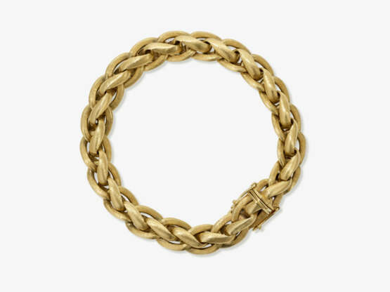 A gold bracelet - photo 1