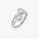 A modified cross over ring set with two brilliant-cut diamonds - photo 1