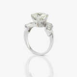 A ring with a large brilliant-cut diamond and diamonds - photo 3