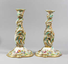 Two Porcelain candlesticks, curved shape, painted, 19. century