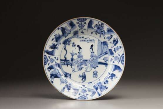 A blue and white plate - photo 1